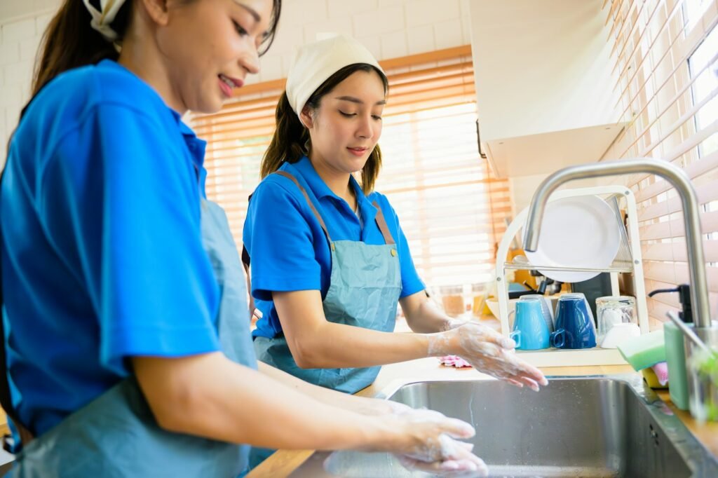 Couple of housekeeping staff cleaning house, Housekeeping and cleaning service, People doing